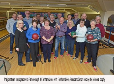 Bowling Teams from Farnborough & Farnham Lions pose for a picture at the end of the annual bowling challenge.